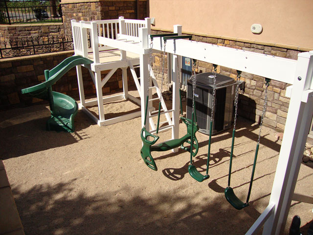 Vinyl play structure with swing set and slide