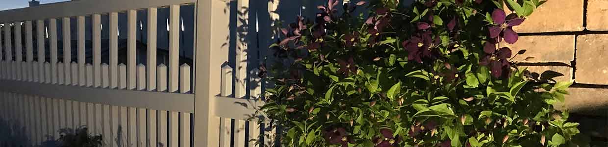 White vinyl alternating picket fence