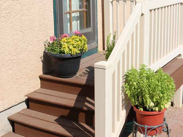 Composite porch with vinyl railing