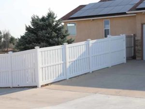 Vinyl semi-privacy fencing on a slope