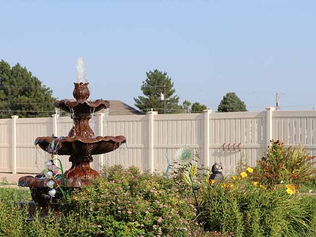Tan vinyl semi-privacy fencing