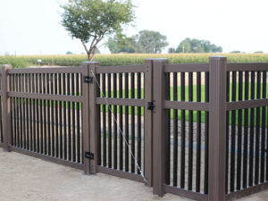 Brown and black closed picket fencing walk gate